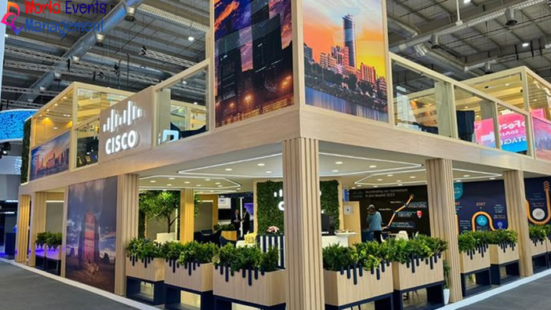 Large double-decker exhibition booth with creative branding and visitor engagement area