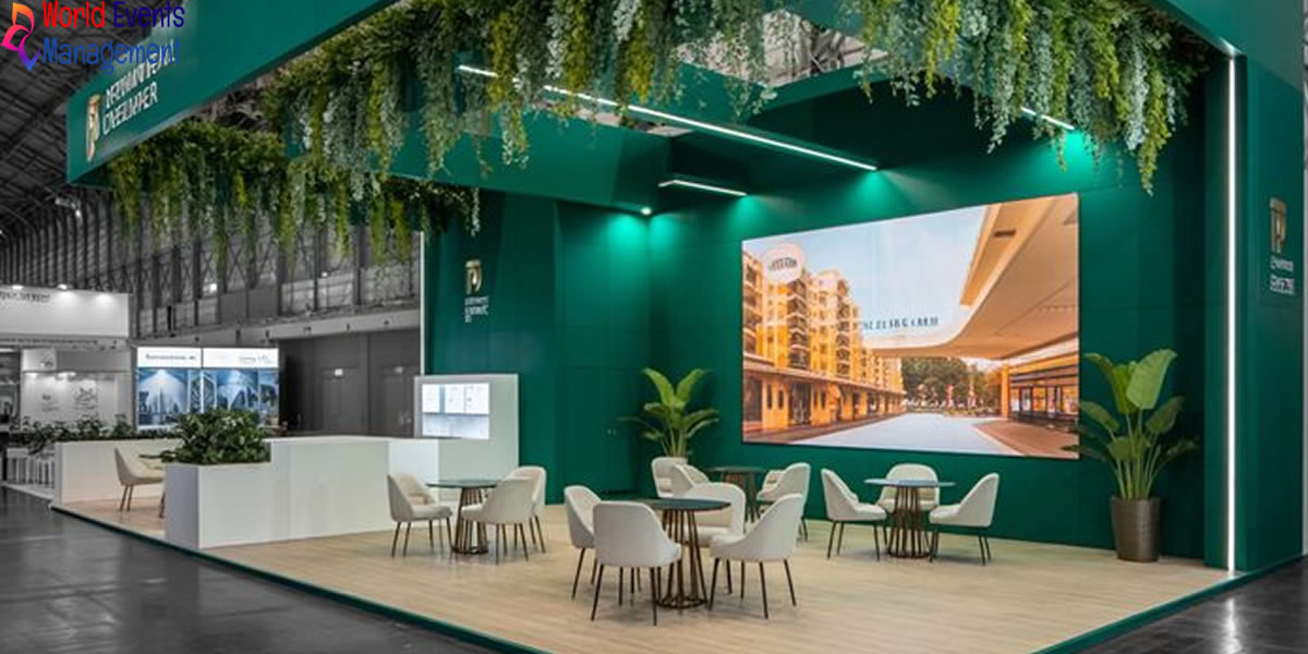 Modern green themed exhibition booth with elegant seating area and creative brand display