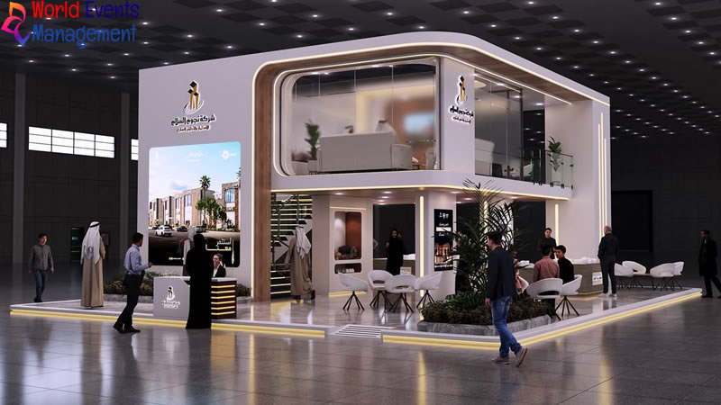 White premium exhibition stand with modern architecture, open layout, and branded display areas