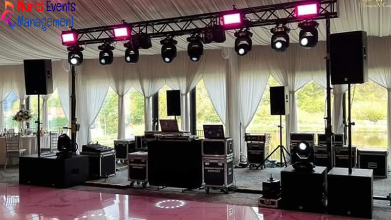 Event audio visual setup with speakers, lighting equipment, and technical production services