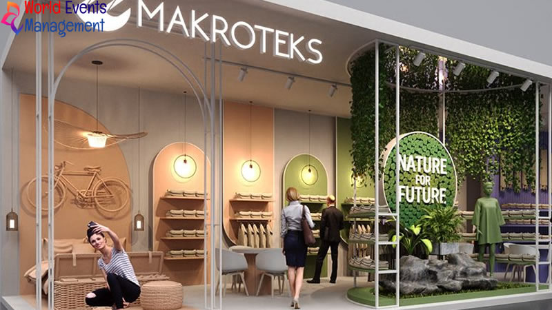 Makroteks exhibition stand featuring a modern wooden design with natural elements and branded display areas
