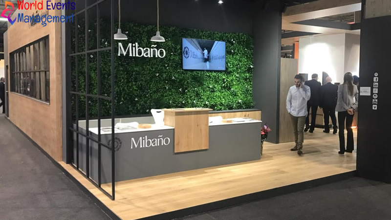 Mibanco exhibition stand with a minimalist design, green branding, and modern visitor space