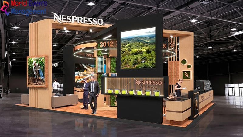Nespresso exhibition stand featuring premium wooden structures, product displays, and modern booth design