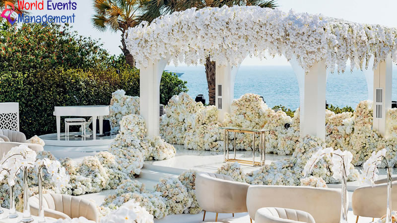 Luxury outdoor wedding style corporate event setup with floral decoration