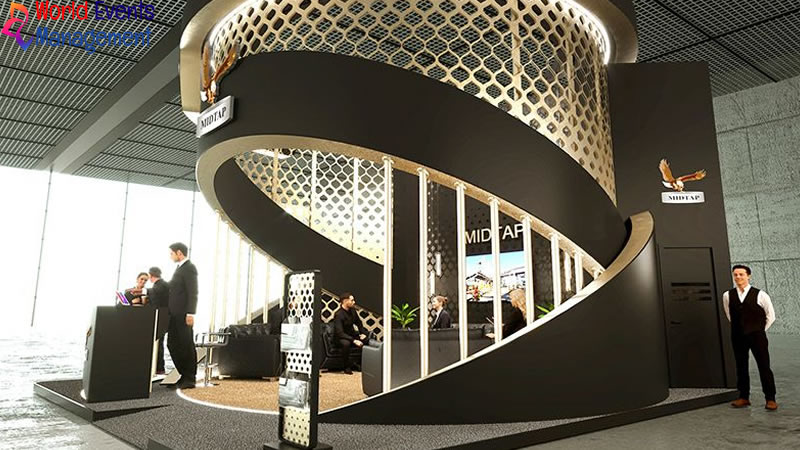 Modern black and white corporate exhibition stand with spiral design and interactive display area