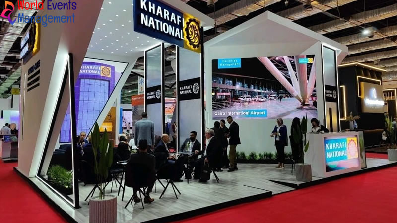 Large custom exhibition booth with modern structure and interactive seating area
